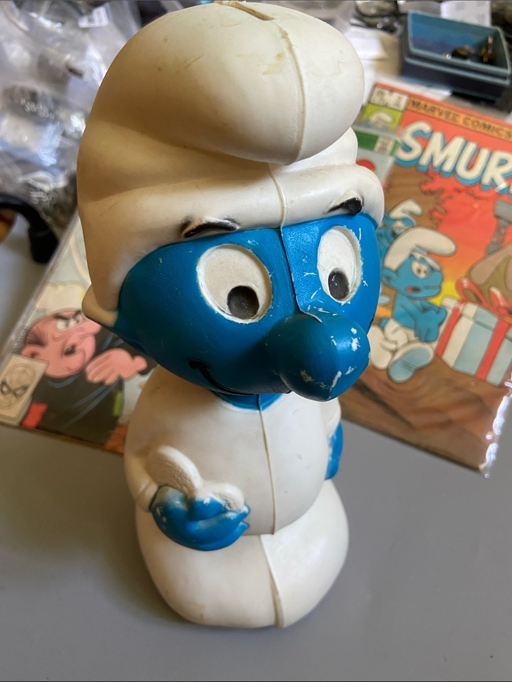 Blue Smurf Vinyl bank with White Hat and Outfit. 11” tall. 4” wide.
